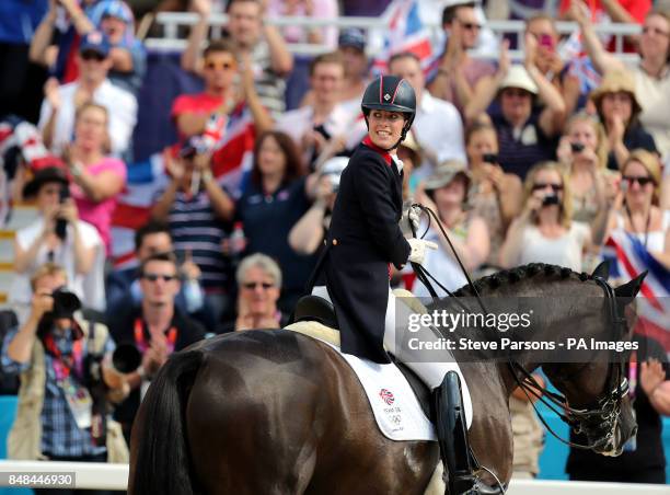 Great Britain's Charlotte Dujardin riding Valegro competes in the Equestrian Dressage Individual Grand Prix Freestyle at Greenwich Park during day 13...