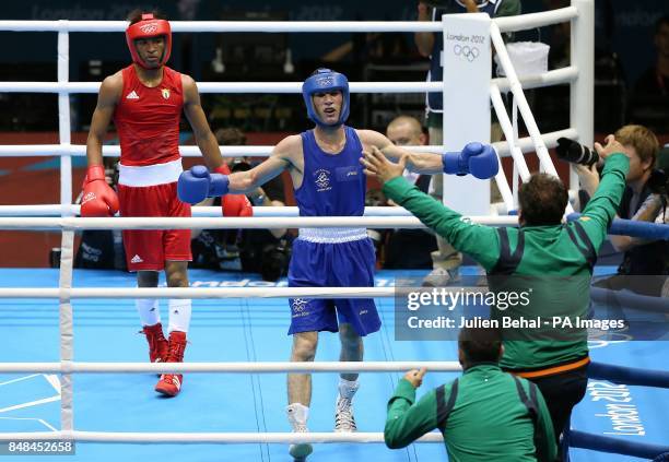 Ireland's John Joe Nevin celebrates with coaches Billy Walsh and Zaur Anita after winning his bout with with Cuba's Lazaro Alvarez Estrada in their...