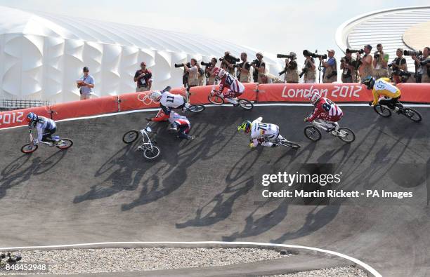 Great Britain's Liam Phillips avoids a crash on the first turn, during the first run of the BMX semifinal at the BMX track in the Olympic Park,...