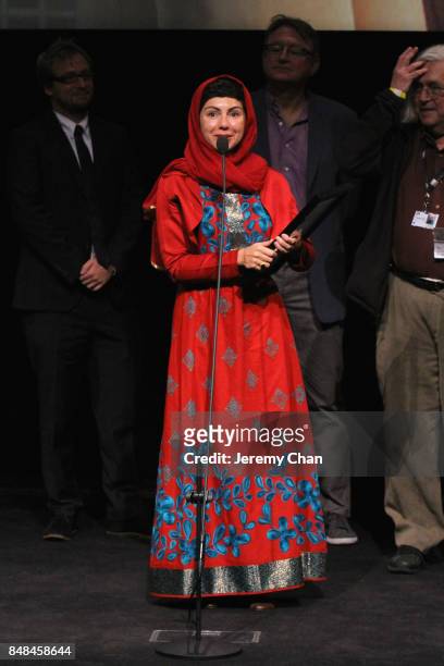 Director Sadaf Foroughi speaks on stage after being awarded with the Prize of the International Federation of Film Critics Discovery for 'Ava' at the...