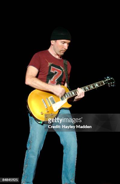 Photo of THE EDGE and U2, The Edge performing live onstage on Elevation tour, playing Gibson Les Paul goldtop guitar