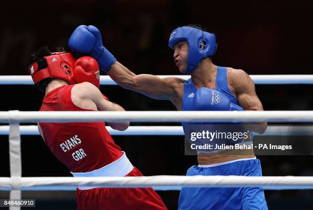 Great Britain's Fred Evans in action against Kazakhstan's Serip Sapiyev the Men's Boxing Welter-Weight Gold Medal fight at the Excel Arena, London.
