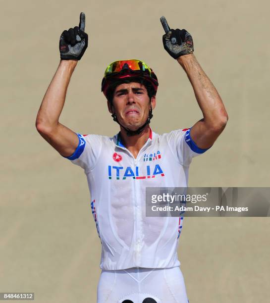 Italy's Marco Aurelio Fontana celebrates his third place in the Men's Cross-Country Mountain Bike Race at Hadleigh Farm, on the final day of the...