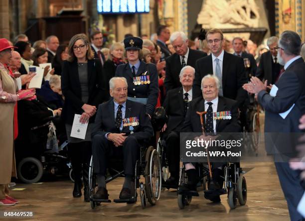 Veterans are applauded as they leave a service marking the 77th anniversary of the Battle of Britain at Westminster Abbey on September 17, 2017 in...