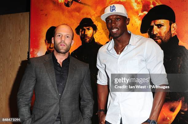 Jason Statham with Olympic Gold Medalist Usain Bolt arriving for the UK Premiere of The Expendables 2, at the Empire Cinema, Leicester Square, London.