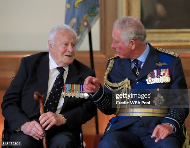Prince Charles, Prince of Wales talks to Battle of Britain veteran Squadron Leader Geoffrey Wellum during a reception following a service marking the...