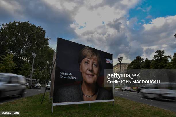 Billboard featuring German Chancellor and leader of the conservative Christian Democratic Union party Angela Merkel is pictured in Berlin on...