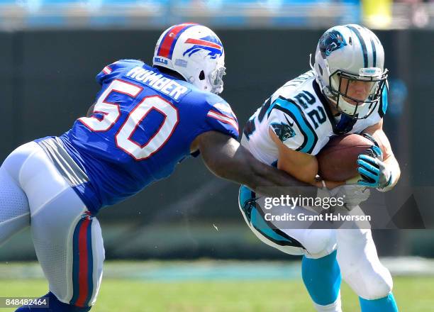 Ramon Humber of the Buffalo Bills tackles Christian McCaffrey of the Carolina Panthers during their game at Bank of America Stadium on September 17,...