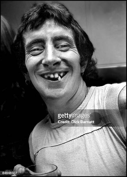 Photo of AC/DC; Bon Scott, posed at press reception in WEA offices