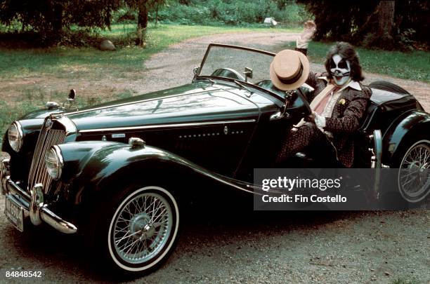 Photo of Peter CRISS and KISS; Peter Criss posed in his vintage sports car