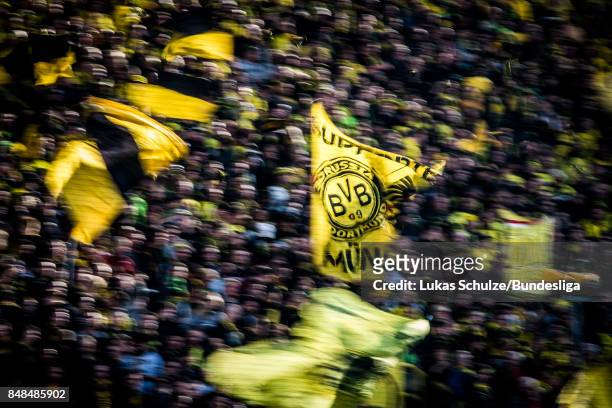Fans of Dortmund support their team with flags prior to the Bundesliga match between Borussia Dortmund and 1. FC Koeln at Signal Iduna Park on...