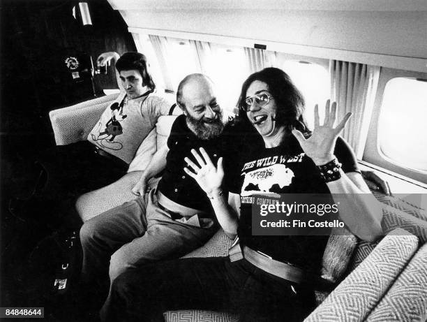 Photo of DEEP PURPLE and David COVERDALE; David Coverdale, posed with accountant & promoter on board the band's Starship plane