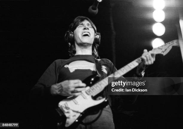 Photo of PINK FLOYD and Roger WATERS, Roger Waters performing live onstage, playing Fender Stratocaster guitar, on In The Flesh tour, wearing pig...