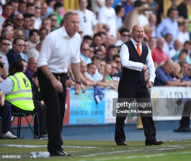 Blackpool's manager Ian Holloway shouts out instruction's to his players during the game during the npower Championship match at The Den, London.