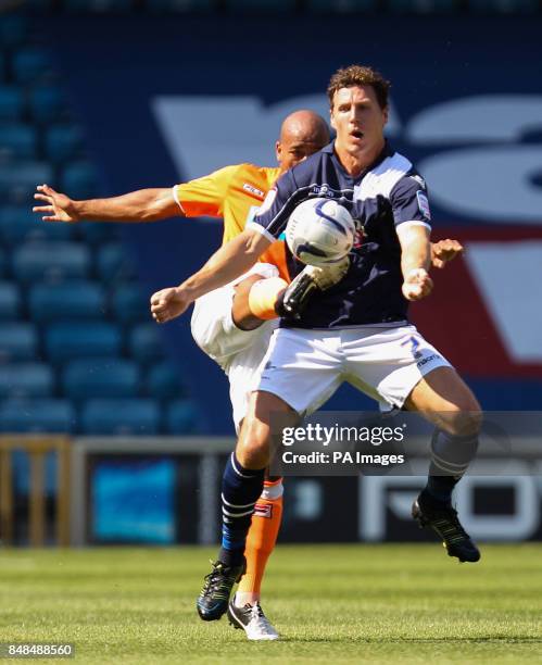 Millwall's Darius Henderson and Blackpool's Alex Baptiste during the npower Championship match at The Den, London.