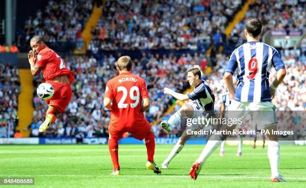 West Bromwich Albion's Zoltan Gera scores past Liverpool's Glen Johnson during the Barclays Premier League match at The Hawthorns, West Bromwich.