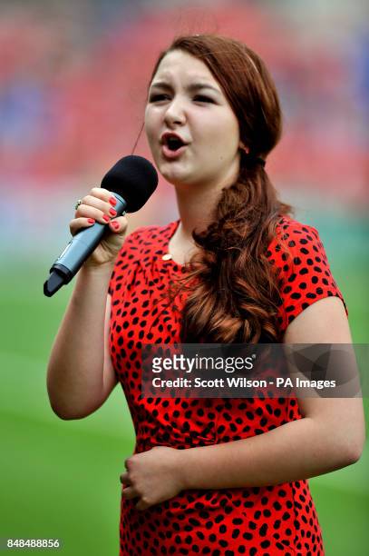 Opera singer Lily Taylor performs prior to kick-off
