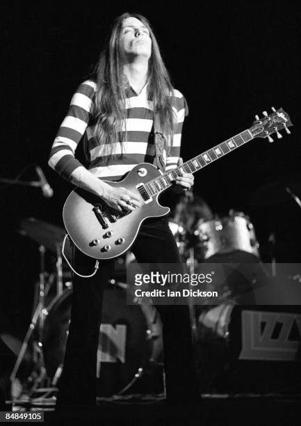 Photo of Scott GORHAM and THIN LIZZY; Scott Gorham performing live onstage, playing Gibson Les Paul Deluxe guitar