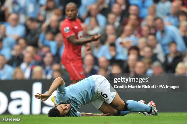 Manchester City's Sergio Aguero holds his knee and looks in pain after a tackle by Southampton's Nathaniel Clyne