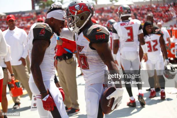 Defensive back Robert McClain of the Tampa Bay Buccaneers celebrates with teammate wide receiver DeSean Jackson following his 47-yard interception...