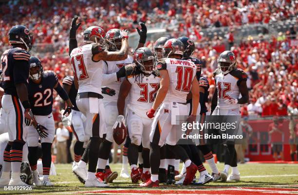 Running back Jacquizz Rodgers of the Tampa Bay Buccaneers celebrates with teammates in the end zone after a 1-yard rush for a touchdown during the...