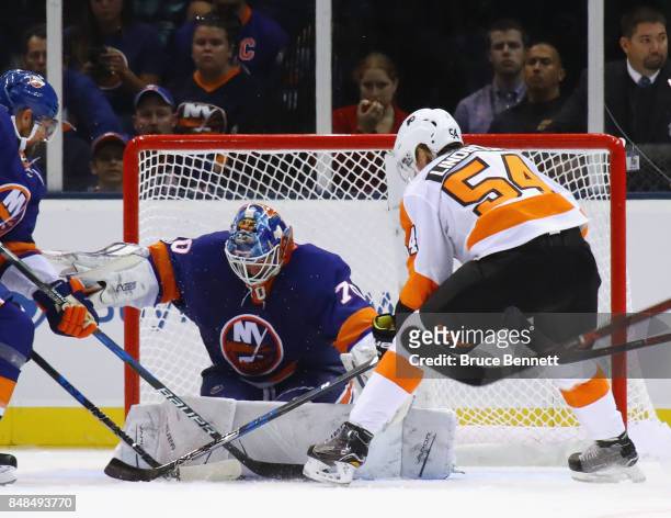 Kristers Gudlevskis of the New York Islanders makes the first period save on Oskar Lindblom of the Philadelphia Flyers during a preseason game at the...