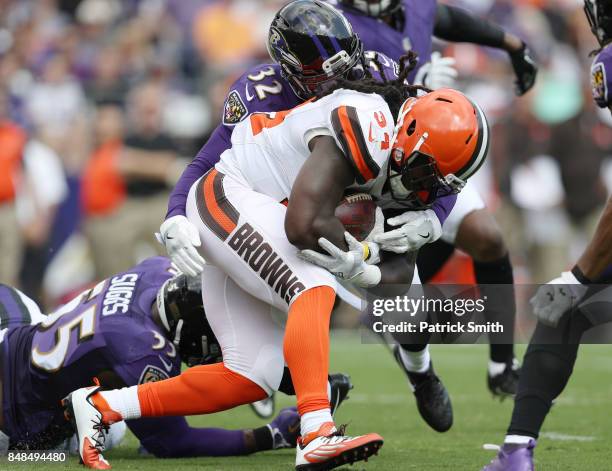 Running back Isaiah Crowell of the Cleveland Browns gets taken down by free safety Eric Weddle of the Baltimore Ravens in the second quarter at M&T...