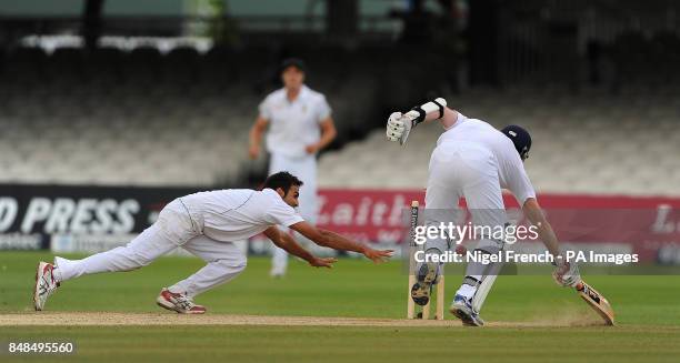 South Africa's Imran Tahir runs out England's Graeme Swann during the Third Investec Test Match at Lord's Cricket Ground, London.