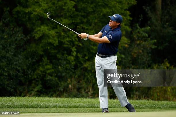 Phil Mickelson hits his second shot on the fifth hole during the final round of the BMW Championship at Conway Farms Golf Club on September 17, 2017...