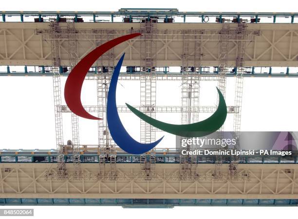 The official symbol of the 2012 Paralympic Games, known as the Agitos, is seen suspended from Tower Bridge, in central London, ahead of its official...