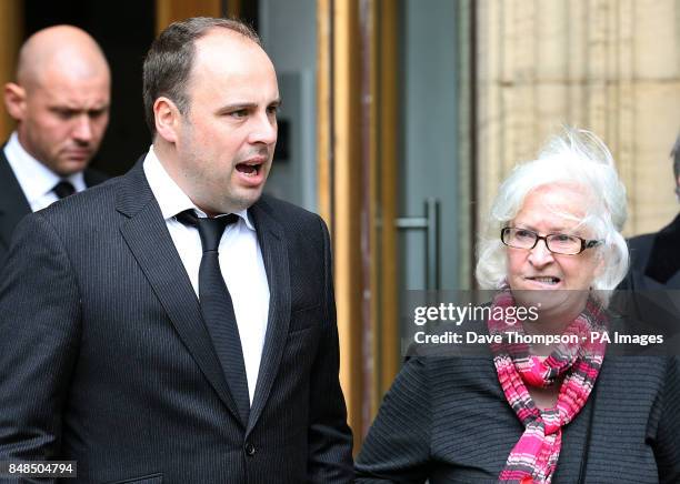 Dan Waddell, left, leaves Pusdey Parish Church in West Yorkshire with the wife of former darts commentator Sid Waddell, Irene, following his fathers...
