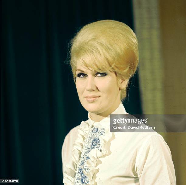 English singer Dusty Springfield , posed on the set of a television show circa 1965.