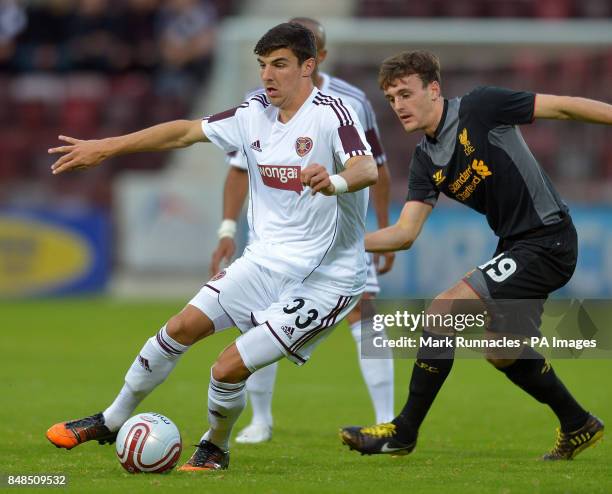 Liverpool's Jack Robinson challenges Hearts' Callum Patterson during the Europa League Qualifying match at Tynecastle Stadium, Edinburgh.