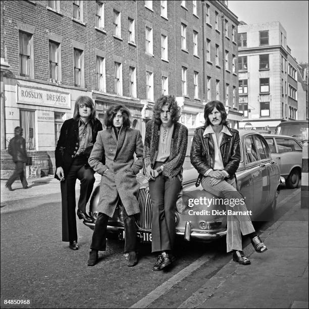 English rock group Led Zeppelin posed on a Jaguar car in London in December 1968. Left to right: John Paul Jones, Jimmy Page, Robert Plant and John...