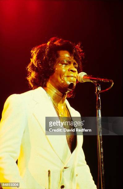 American soul singer and songwriter James Brown performs live on stage at the Hammersmith Odeon in London in December 1981. James Brown would play...