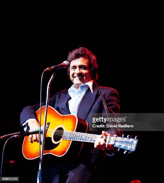 Photo of Johnny CASH, Johnny Cash performing on stage at Festival of Country Music, playing Martin acoustic guitar