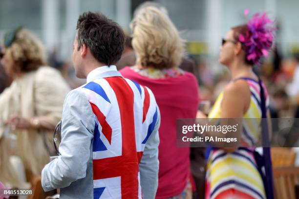 Racegoer wearing a Union Jack flag stitched into his suit jacket at Goodwood Racecourse