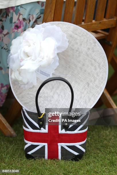 Ladies hat sits in a Union Jack handbag at Goodwood Racecourse