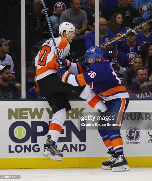 Samuel Morin of the Philadelphia Flyers is checked by Andrew Ladd of the New York Islanders during the third period during a preseason game at the...
