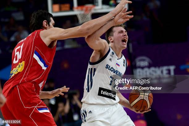 Slovenia's guard Luka Doncic vies for the ball with Serbia's center Boban Marjanovic during the FIBA Eurobasket 2017 men's Final basketball match...