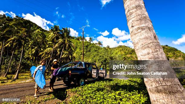 surfers on anjouan island - anjouan island stock pictures, royalty-free photos & images