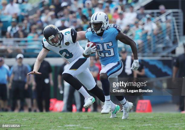 Adoree' Jackson of the Tennessee Titans returns a punt deep in front of Brad Nortman of the Jacksonville Jaguars during the second half of their game...