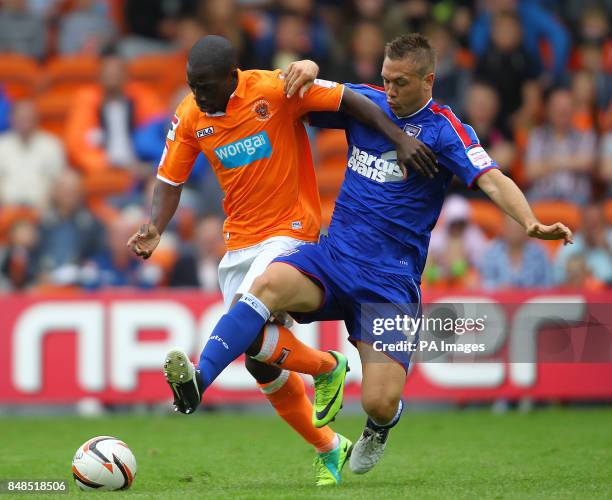 Blackpool's Nouha Dicko and Ipswich Town's Luke Chambers during the npower Football League Championship match at Bloomfield Road, Blackpool.