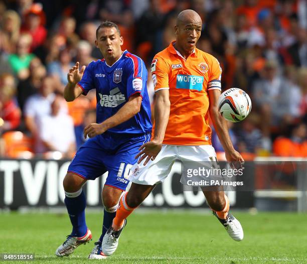 Blackpool's Alex Baptiste and Ipswich Town's Michael Chopra during the npower Football League Championship match at Bloomfield Road, Blackpool.