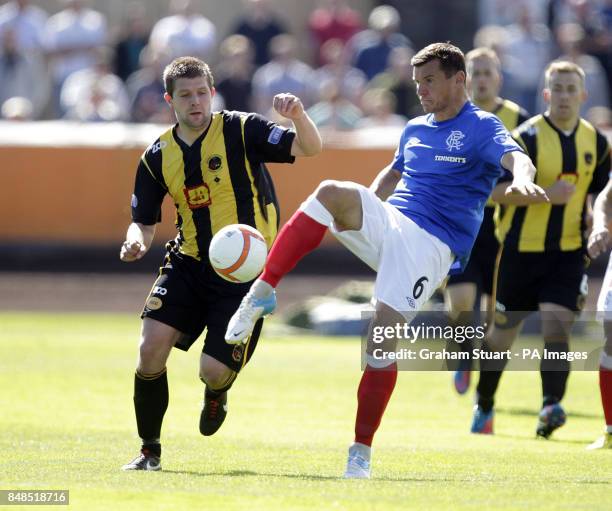 Berwick Rangers' Neil Janczyk battles with Rangers' Lee McCulloch during the Scottish Division 3 match at Shielfield Park, Berwick-upon-Tweed.