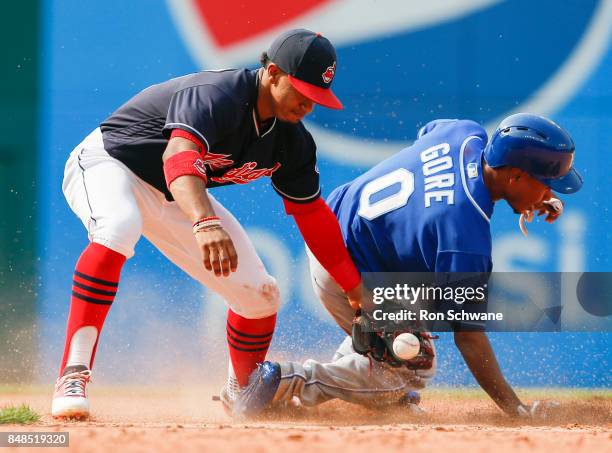 Terrance Gore of the Kansas City Royals steals second base as the ball gets away from Francisco Lindor of the Cleveland Indians during the eighth...