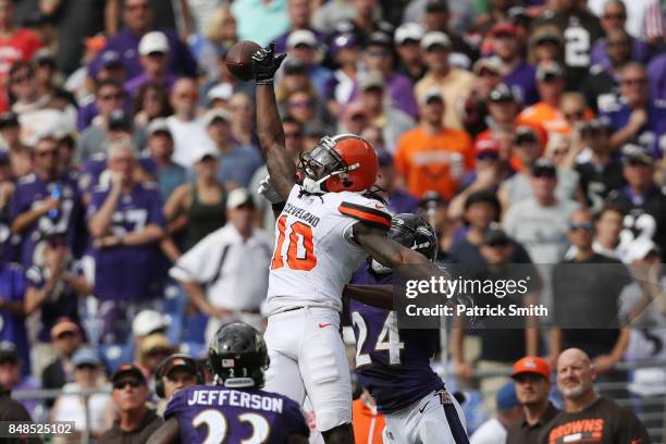 Wide receiver Sammie Coates of the Cleveland Browns and cornerback Brandon Carr of the Baltimore Ravens fight for the ball in the third quarter at...