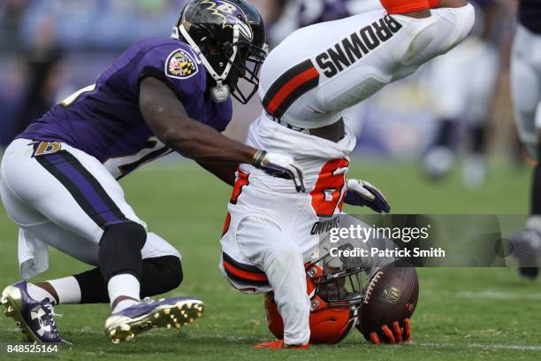 Running back Duke Johnson of the Cleveland Browns makes a catch as free safety Lardarius Webb of the Baltimore Ravens tries to stop him in the third...