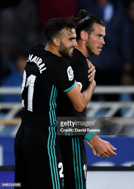 Gareth Bale of Real Madrid CF celebrates with his team mates Borja Mayoral after scoring his team's third goal during the La Liga match between Real...