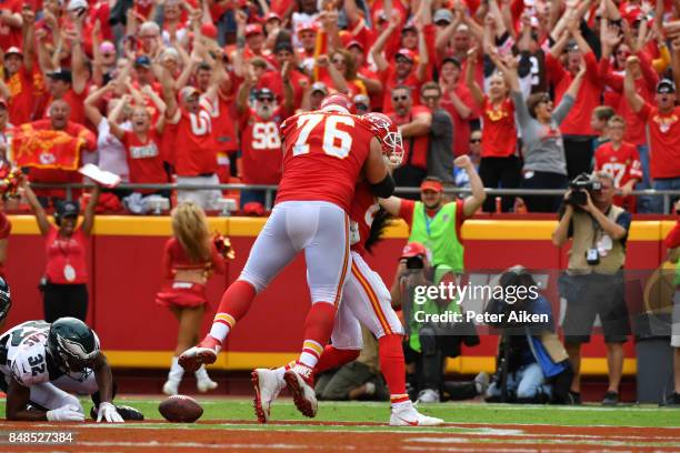 Laurent Duvernay-Tardif celebrates with tight end Travis Kelce of the Kansas City Chiefs after he scored a touchdown against the Philadelphia Eagles...